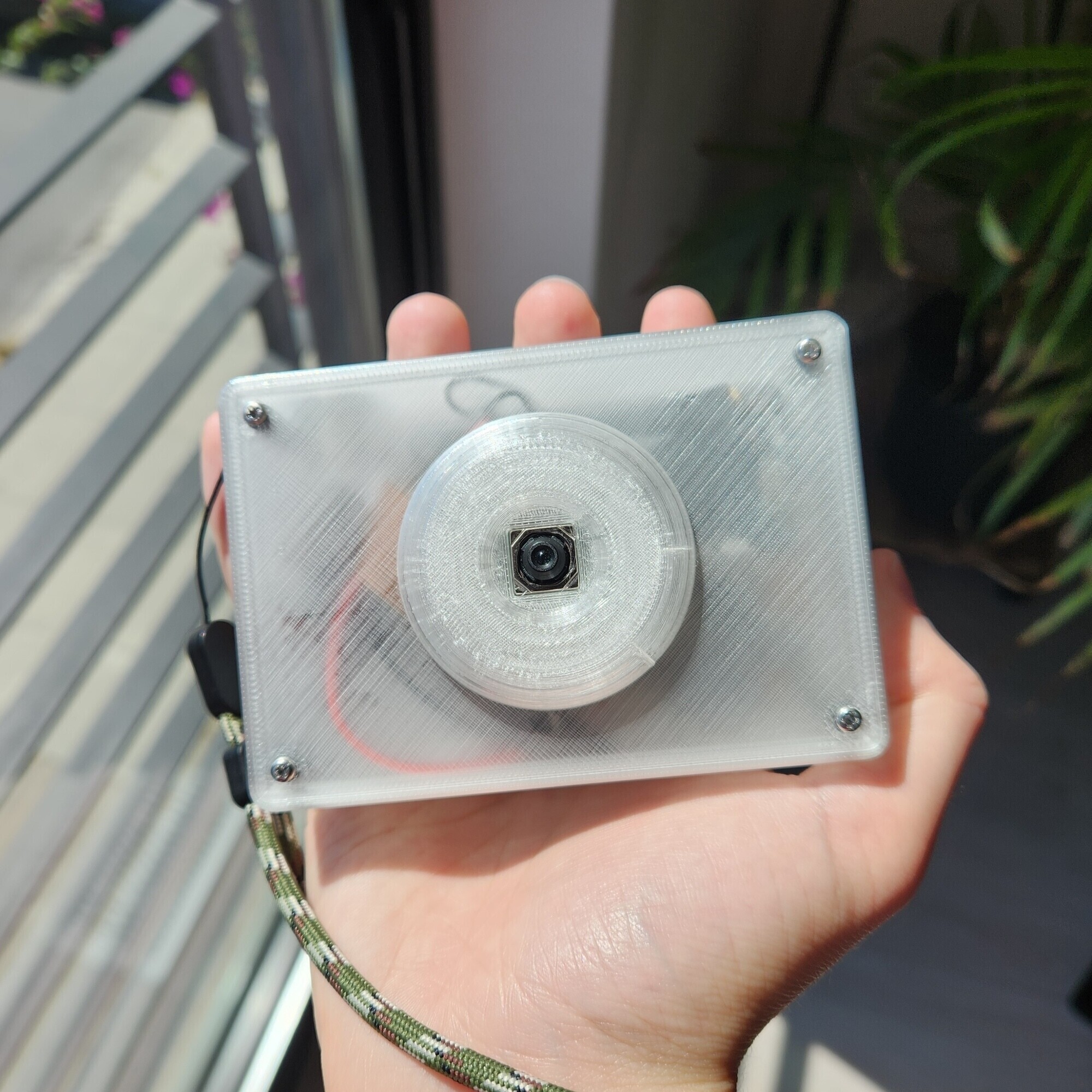 reFrame ePaper camera in hand