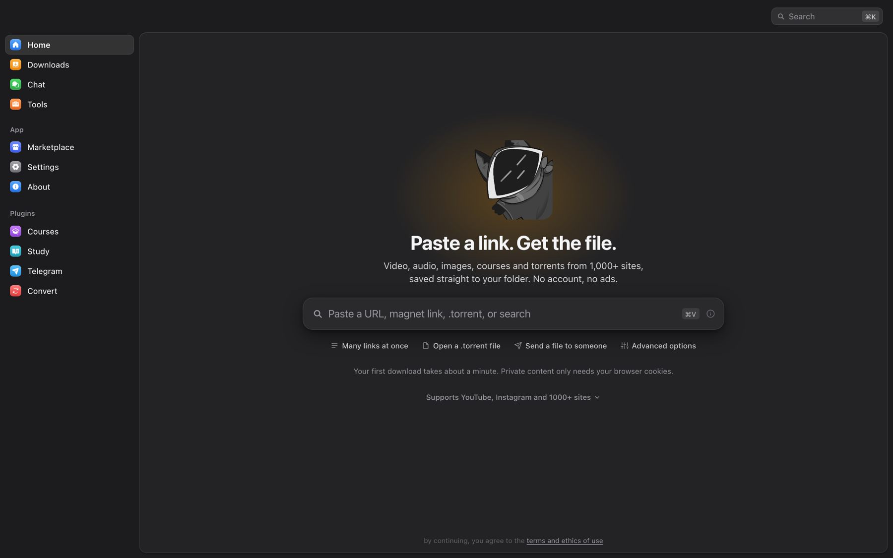 OmniGet home screen: paste a URL, magnet link or .torrent and the file lands in your folder