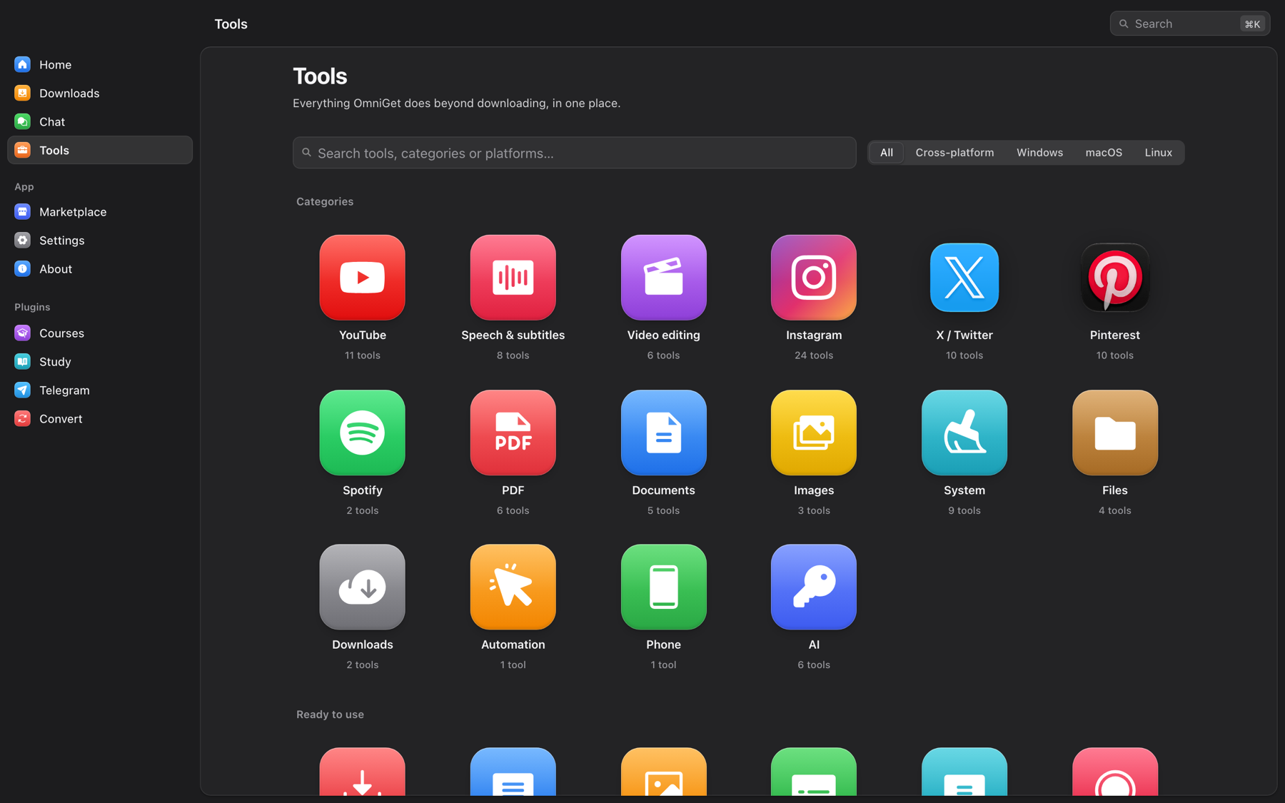 OmniGet Tools hub with 16 categories: YouTube, Speech and subtitles, Video editing, Instagram, X, Pinterest, Spotify, PDF, Documents, Images, System, Files, Downloads, Automation, Phone and AI