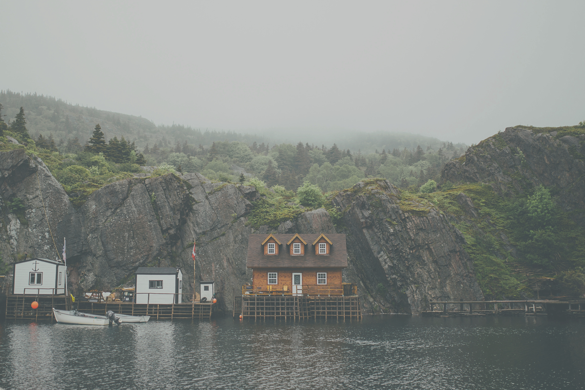 a house on stilts on a lake