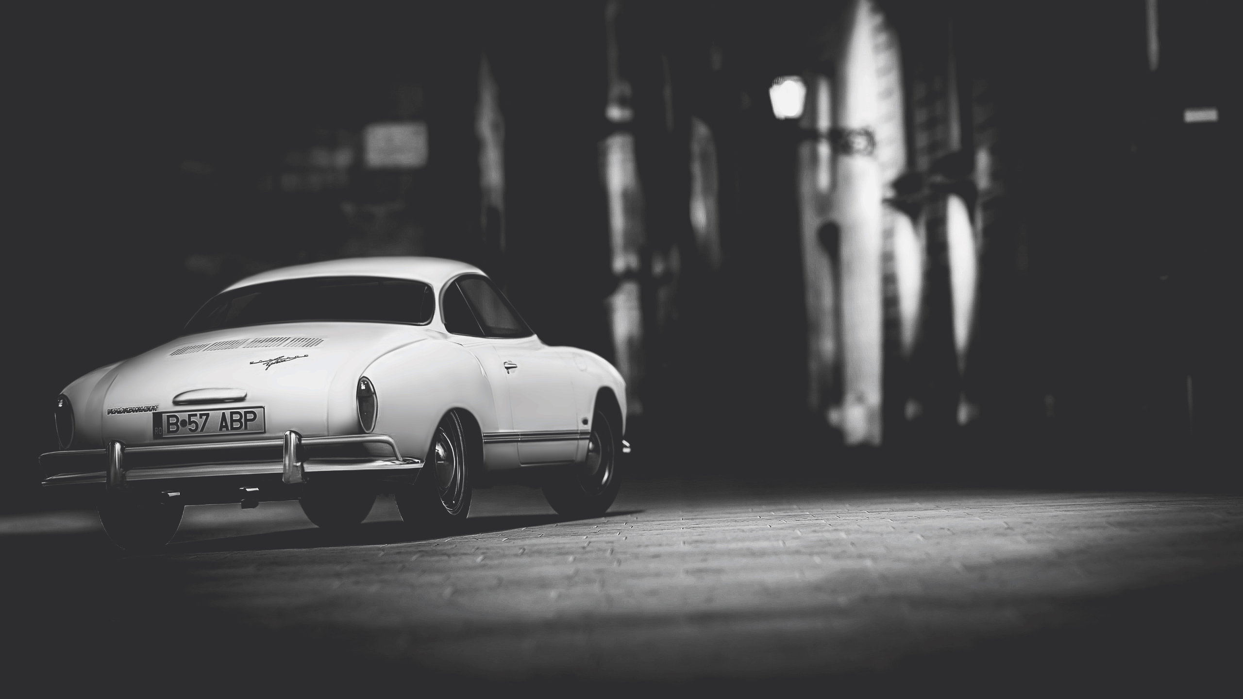 a white car parked on a brick road