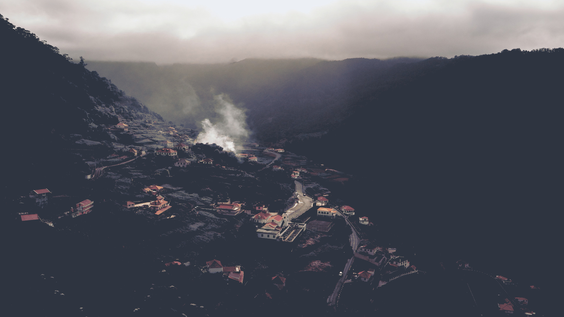 a smoke coming out of a mountain